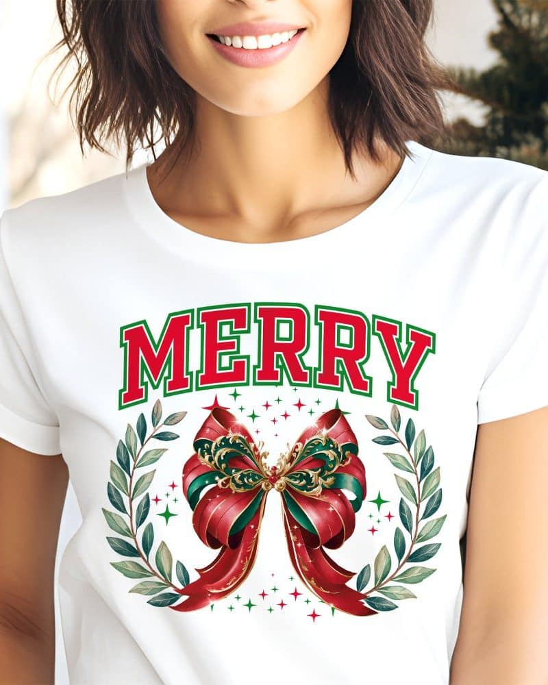 White t-shirt with Merry in red and a large red and green bow graphic.