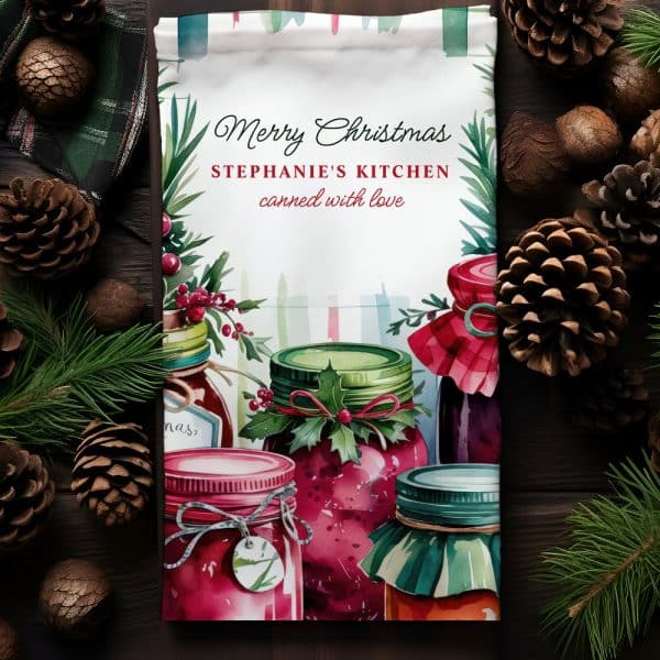 Christmas Tea Towel Featuring Watercolor Jars Of Jam, Decorated With Holly.
