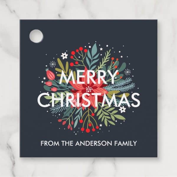 Dark Blue Square Christmas Gift Tag With A Floral Wreath Design, &Quot;Merry Christmas&Quot; In White Lettering, And &Quot;From The Anderson Family&Quot; At The Bottom.