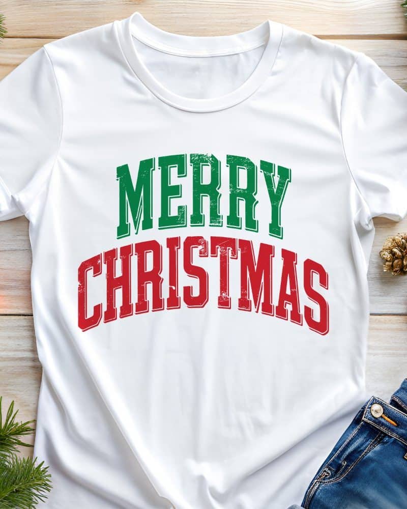 White t-shirt with Merry Christmas in green and red text.
