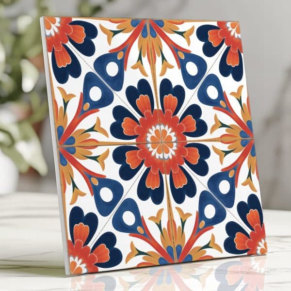 Square Tile With A Colorful Floral Pattern In Shades Of Orange, Blue, And Yellow.