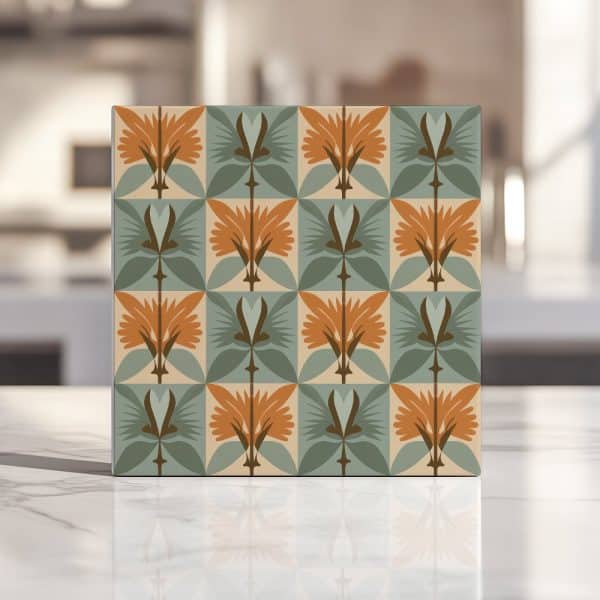 Square Tile With Repeating Geometric Floral Pattern In Orange, Green, And Beige.
