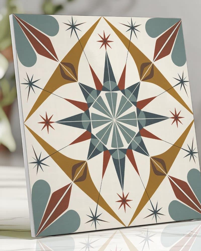 A square tile with a geometric, starburst design in teal, mustard yellow, and burnt orange.