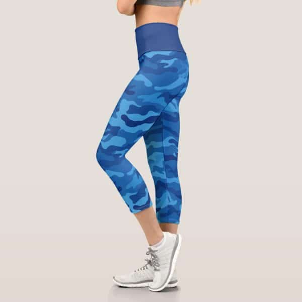 Woman Wearing Blue Camouflage Cropped Leggings And White Athletic Shoes.