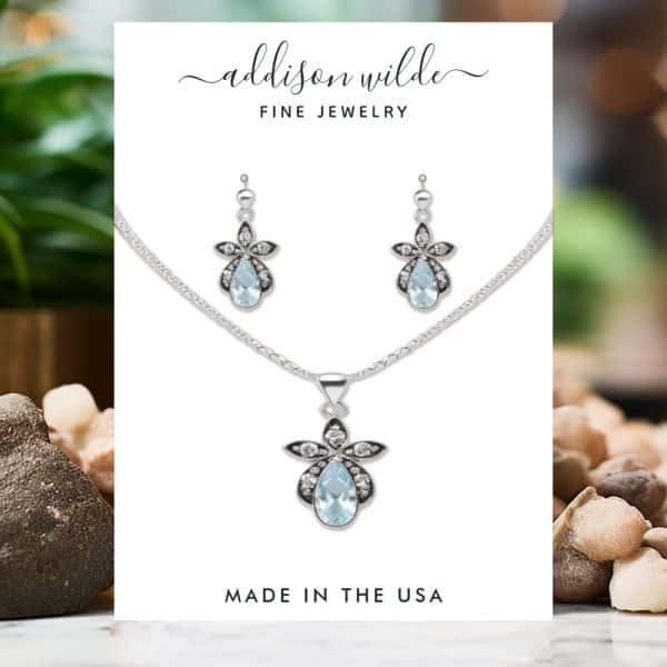Silver Necklace And Earring Set With Light Blue Teardrop Pendants And Floral Accents. Made In The Usa.
