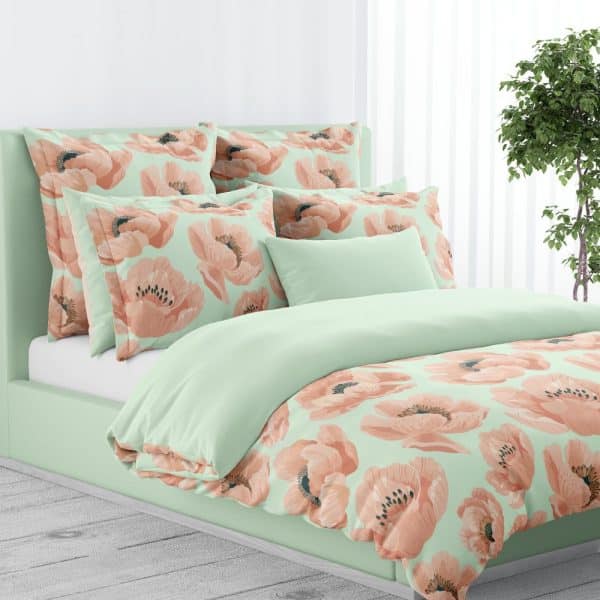 Light Green Duvet Cover And Pillows With A Peach Poppy Floral Pattern.