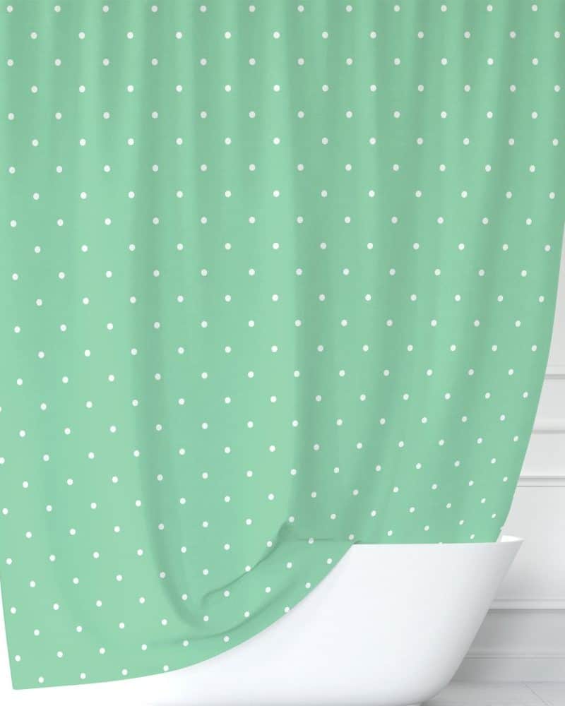 Mint green shower curtain with white polka dots.