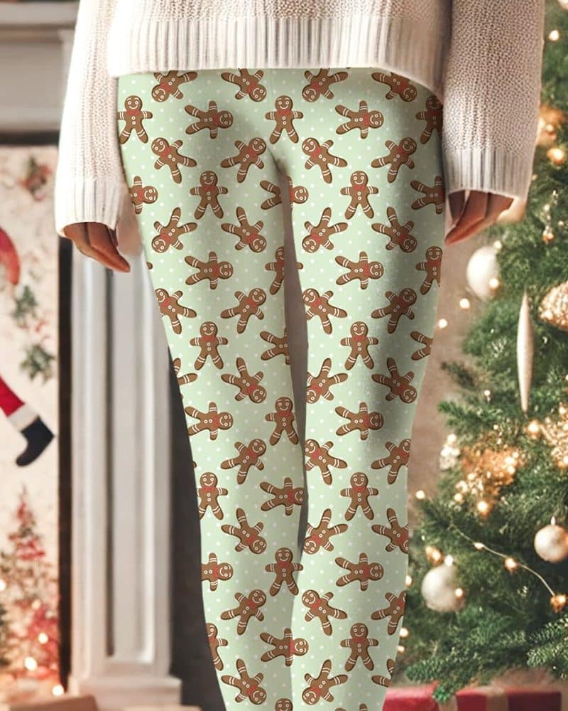 Pair of light green leggings featuring a repeating pattern of gingerbread men.