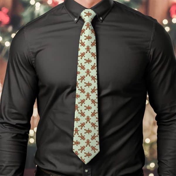 A Man Wearing A Light Green Tie Patterned With Gingerbread Men.