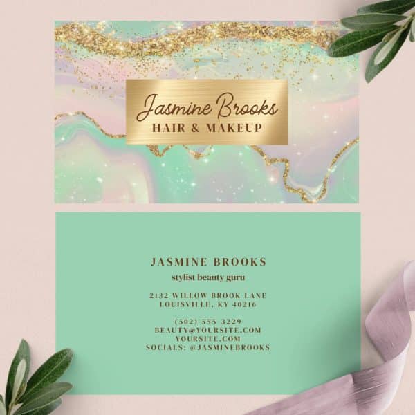 A Business Card For Jasmine Brooks, Hair And Makeup Stylist, Featuring A Mint Green And Gold Design.