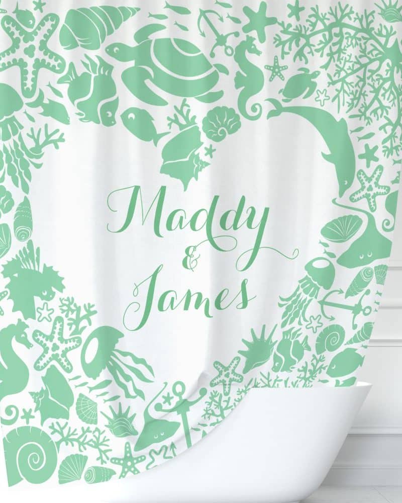 Mint green sea creature shower curtain with the names Maddy & James in the center.