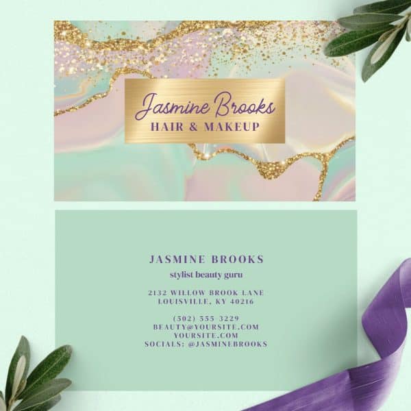 Business Card For Jasmine Brooks, Hair And Makeup Stylist. The Design Features A Pastel Marble Background With Gold Glitter Accents.