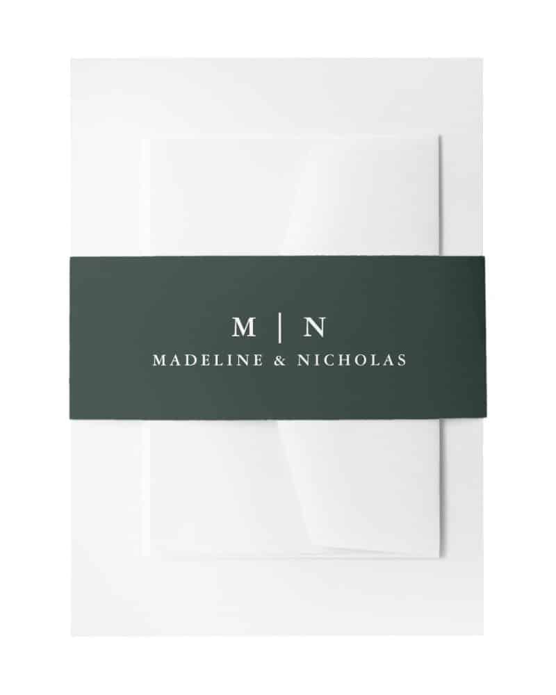 White stationery with a dark green band, imprinted with Madeline & Nicholas's initials and names.