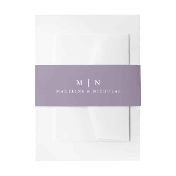 White Wedding Invitation With A Lavender Band Featuring The Initials Mn And The Names Madeline &Amp; Nicholas.