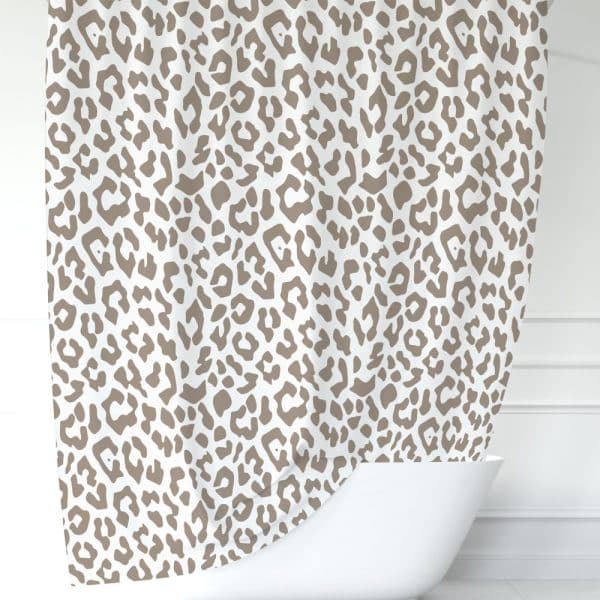 Beige Leopard Print Shower Curtain Draped Over A White Bathtub.