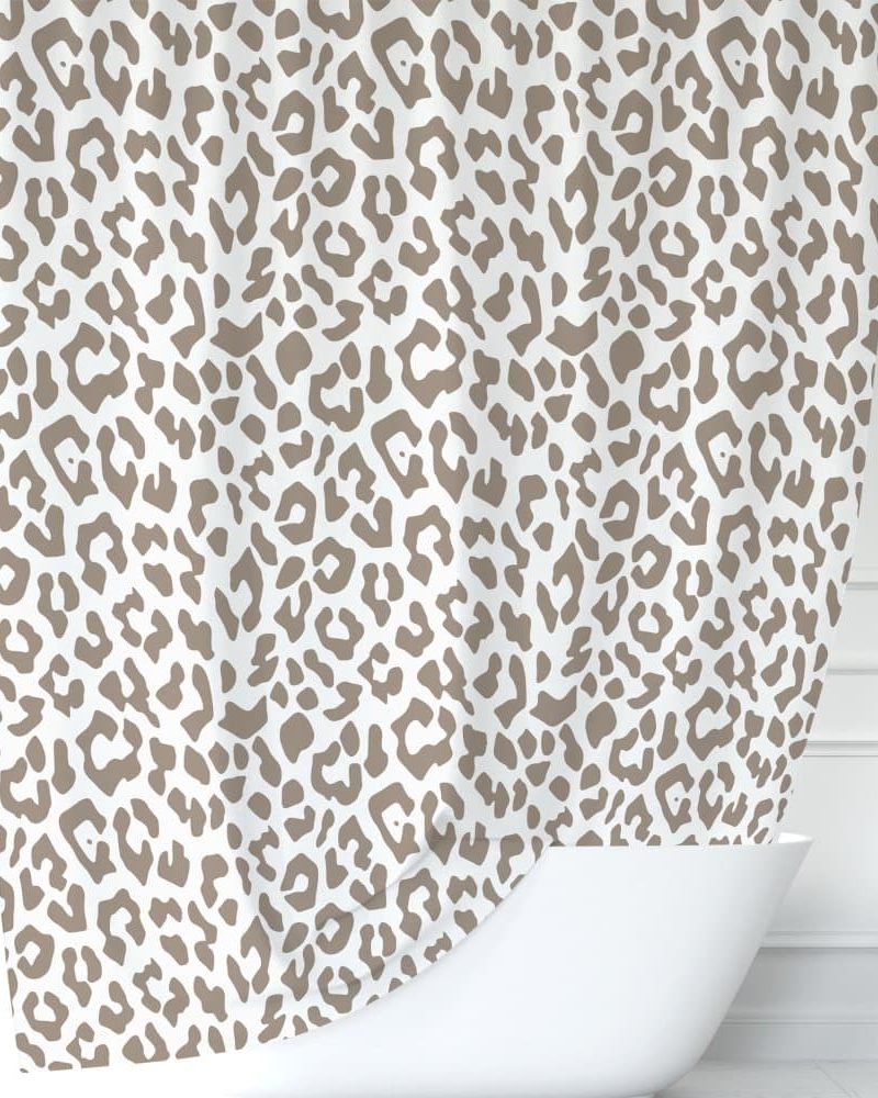 Beige leopard print shower curtain draped over a white bathtub.