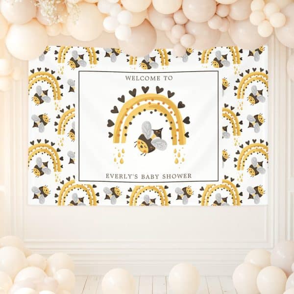 Baby Shower Banner Featuring A Bee Flying Under A Rainbow Decorated With Hearts. The Banner Also Includes The Baby'S Name And &Quot;Welcome To Everly'S Baby Shower.&Quot;