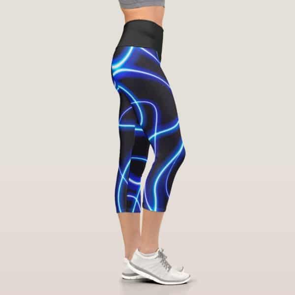 Womens Cropped Leggings With A Neon Blue Light Pattern On A Dark Background.