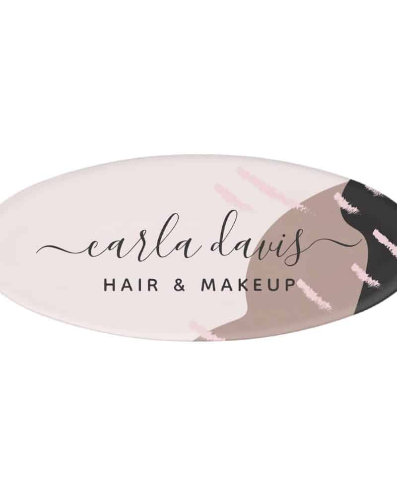 Oval logo for Carla Davis Hair & Makeup. The logo features an abstract design in muted pinks, browns, and black.