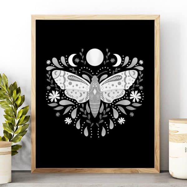 Silver Moth Illustration On Black Background, Surrounded By Floral Designs And Moons.