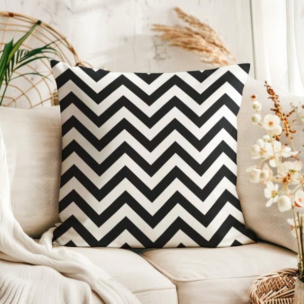 Black And White Chevron Patterned Throw Pillow On A Beige Couch.