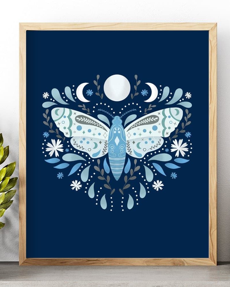 Framed illustration of a light blue moth centered on a dark blue background, surrounded by floral elements and crescent moons.