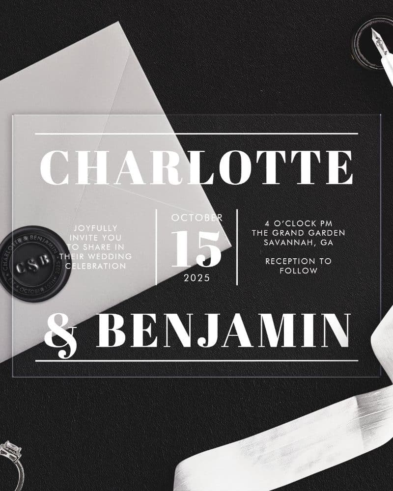 Clear acrylic wedding invitation for Charlotte and Benjamin, October 15, 2025, at The Grand Garden in Savannah, Georgia.