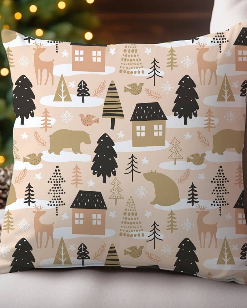 Beige throw pillow with a repeating pattern of winter animals and houses.