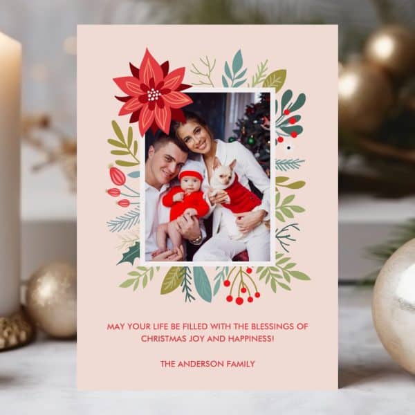 Christmas Card Featuring A Family Photo Surrounded By A Floral Wreath.