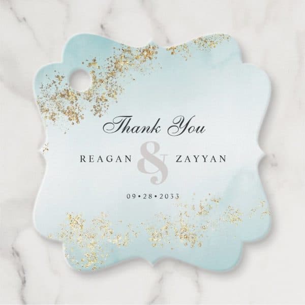 Light Blue Thank You Tag With Gold Accents, Featuring The Names Reagan &Amp; Zayyan And The Date 09.28.2033.