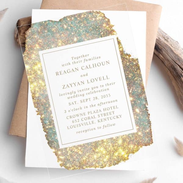 Wedding Invitation With Gold And Teal Glitter Design; Reagan Calhoun And Zayyan Lovell'S Wedding Details Are Featured.