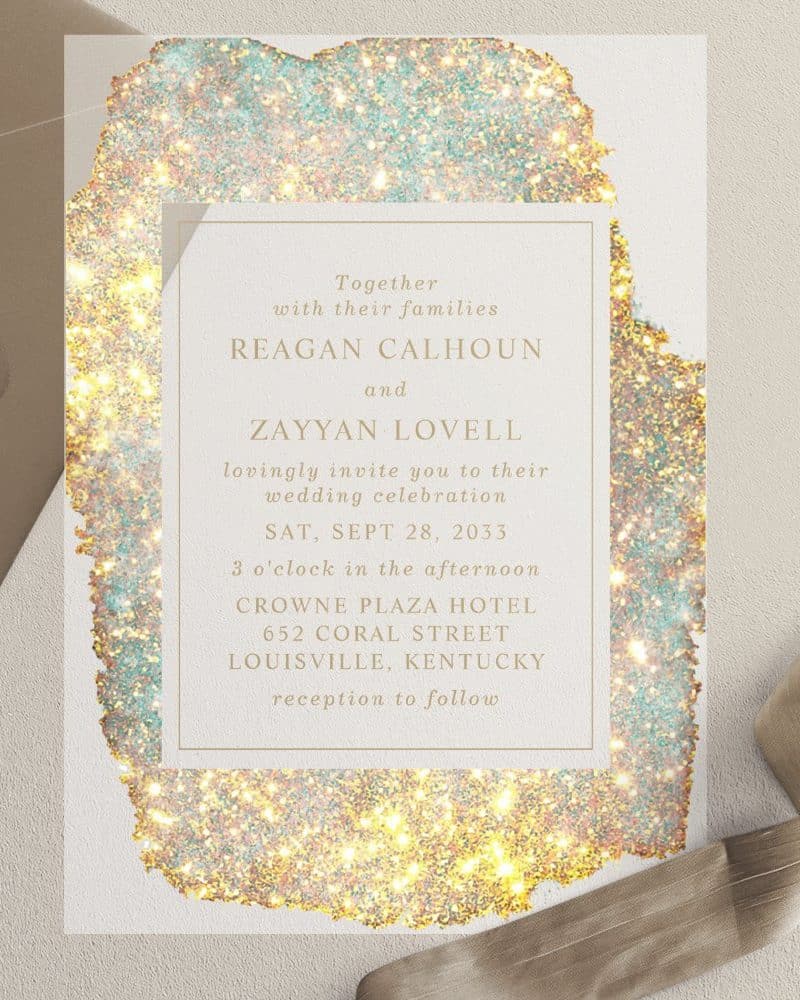 Wedding invitation for Reagan Calhoun and Zayyan Lovell, September 28, 2033, at the Crowne Plaza Hotel in Louisville, Kentucky. The invitation features a sparkly gold and teal design.