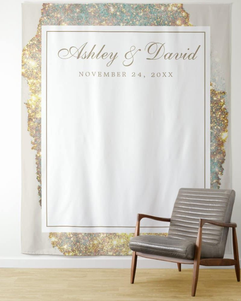 Wedding guest book backdrop with gold glitter border, Ashley & David's names, and wedding date.