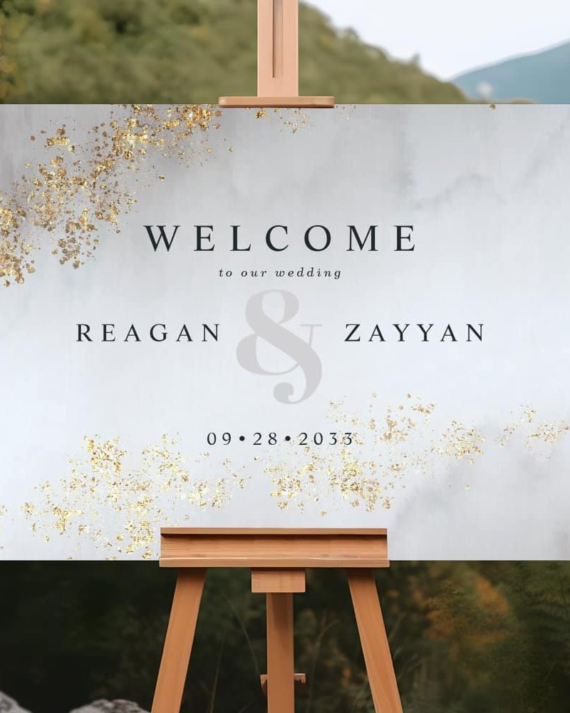 Wedding welcome sign for Reagan and Zayyan, September 28, 2033. The sign has a marble design with gold accents.