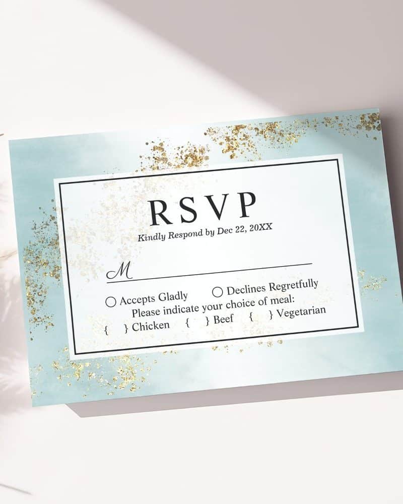 RSVP card with light blue background, gold accents, and meal choices.