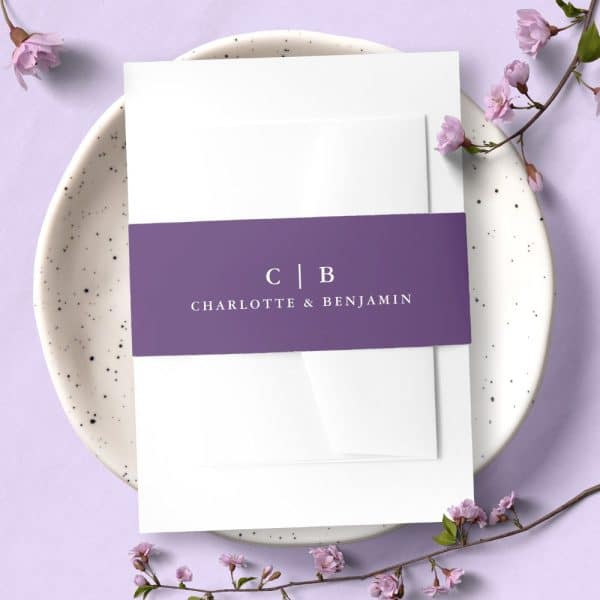 Wedding Invitation With A Purple Band Displaying The Initials Cb And Names Charlotte &Amp; Benjamin.