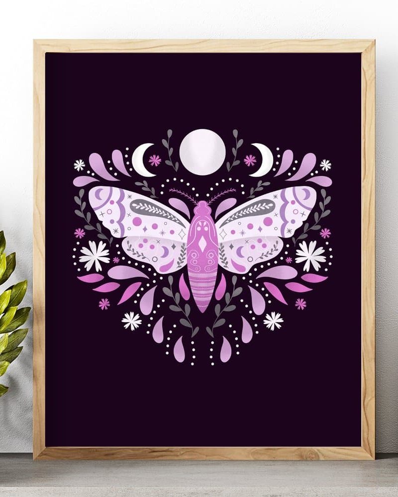 Framed artwork featuring a purple moth centered in a floral design, accented by moons and stars on a dark background.