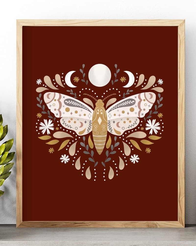 Ornate moth illustration in earth tones, framed.