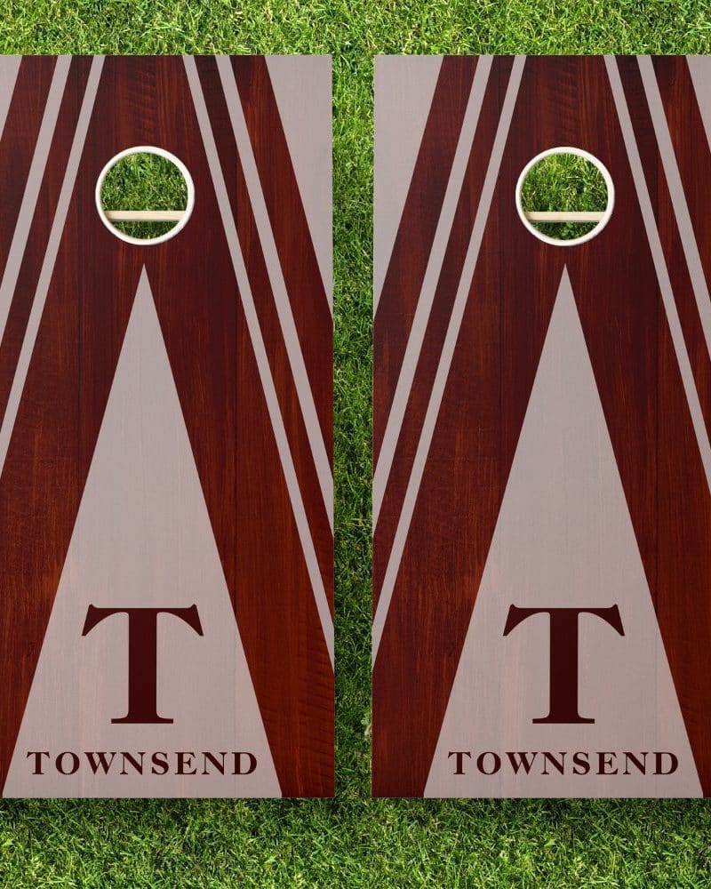 Pair of personalized brown and beige cornhole boards with the initial T and the last name Townsend.