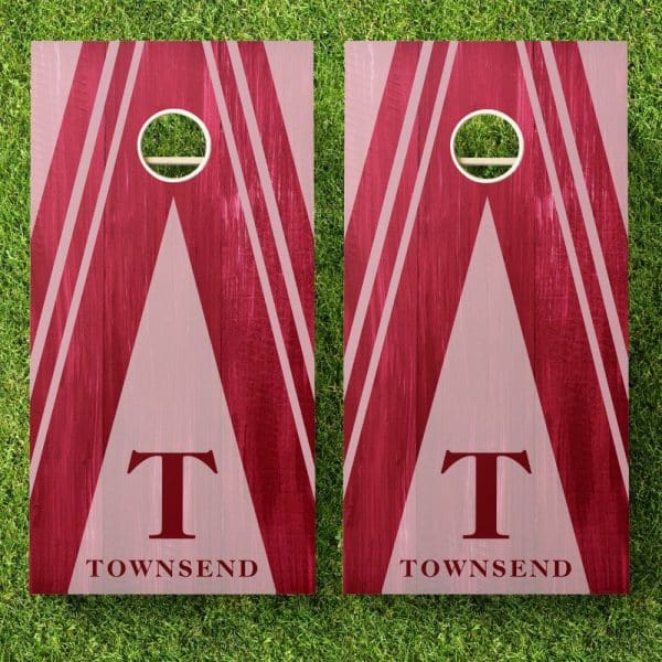 Pair Of Maroon And Pink Cornhole Boards With The Initial T And The Name Townsend.