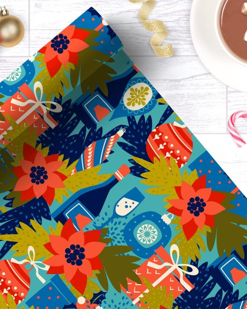 Festive teal Christmas wrapping paper featuring poinsettias, ornaments, champagne bottles, and gifts.