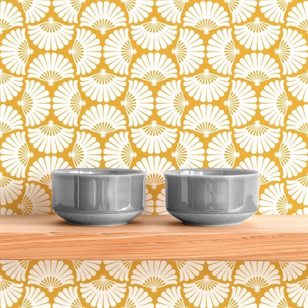Two Gray Bowls Sit On A Wooden Shelf Against A Yellow And White Patterned Wall.
