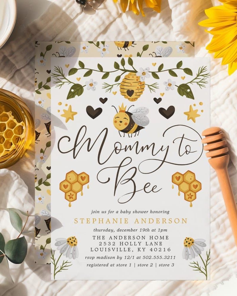 Baby shower invitation featuring a cartoon bee wearing a crown, honeycomb, and floral designs. The invitation text reads "Mommy to Bee".