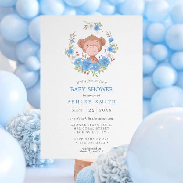 Baby Shower Invitation Featuring A Cartoon Monkey In A Floral Wreath.