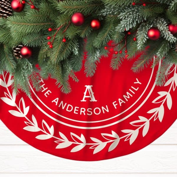 Red Christmas Tree Skirt With The Anderson Family Name And A Monogrammed A. It Is Decorated With A White Laurel Wreath.