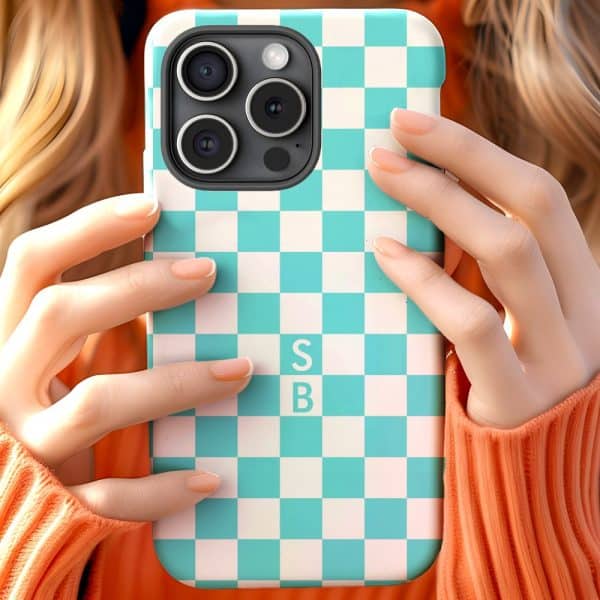 A Person'S Hands Holding A Teal And White Checkered Phone Case With The Initials Sb.