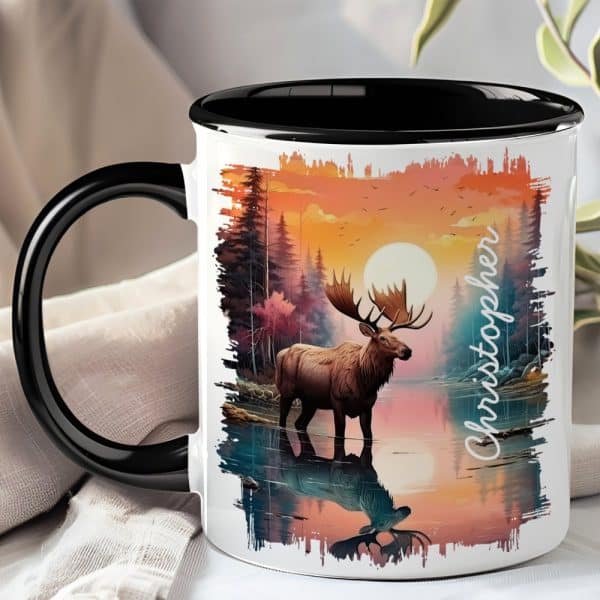 A Black-Handled Mug Features A Painting Of A Moose Standing In A Calm Lake At Sunset, With The Name Christopher Printed On The Side.