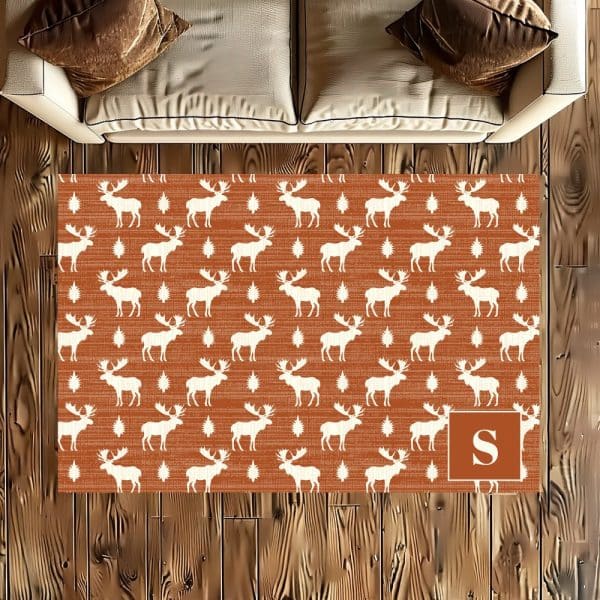 Rustic Orange Rug With A Repeating Pattern Of White Moose And Stars, Personalized With A White Letter S.