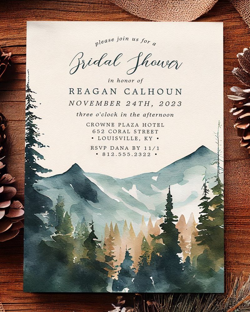 Bridal shower invitation with watercolor painting of mountains and evergreen trees.