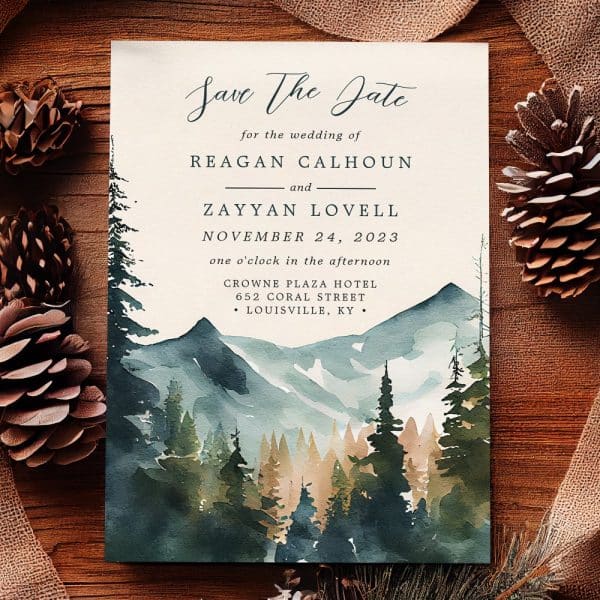 Save The Date For Reagan Calhoun And Zayyan Lovell'S Wedding, November 24, 2023, At The Crowne Plaza Hotel In Louisville, Kentucky. The Design Features A Watercolor Painting Of Mountains And A Forest.